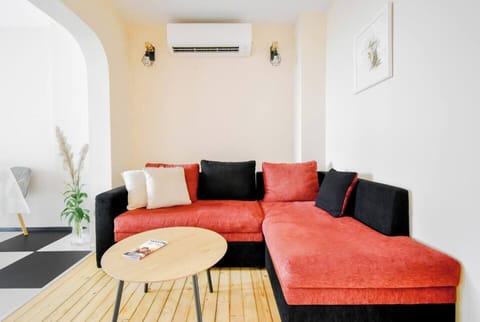 Relax in the stylish living room, where the cozy seating area invites you to unwind after a day of exploring Sofia.