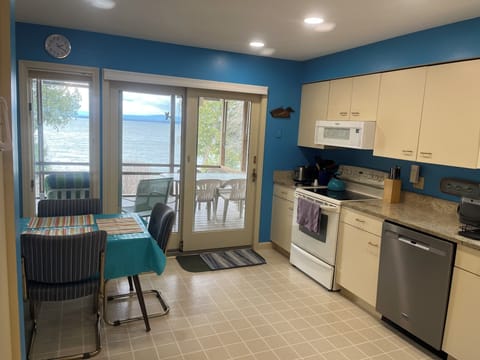 Kitchen with view from the stove and kitchen table