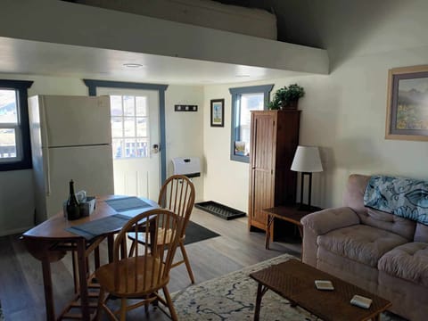 Front door. Electric wall heater to the right of the door.