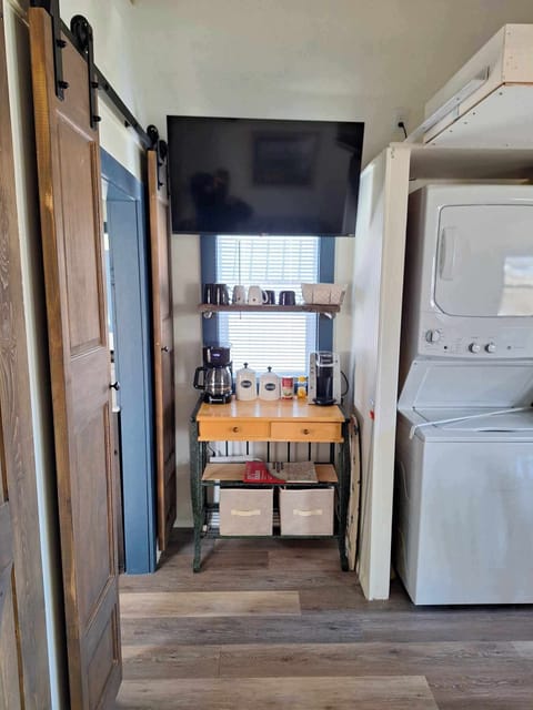 Coffee bar. TV mounted above.