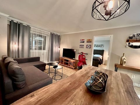 A stylish open-concept living and dining space with warm lighting and modern decor
