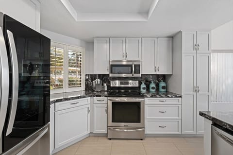 Kitchen fully stocked with all appliances and gadets.