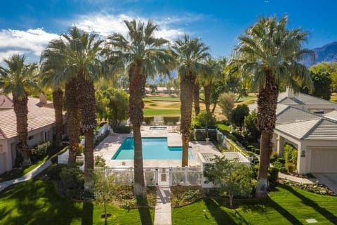 Resort-style pool with palm trees — relax just steps from your condo.