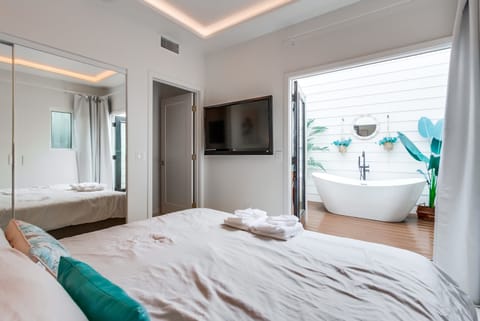 King bed in the bedroom, plus a private open air luxury soaking tub and pack patio