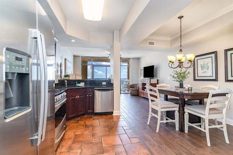 A wide view from the kitchen highlights the seamless transition between the cooking space and dining area.