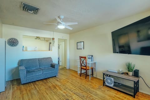 Living room with couch and 65 inch Smart TV!