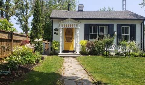 Old Blacksmith's Cottage front garden - very close to Centre and Shaw Theatre