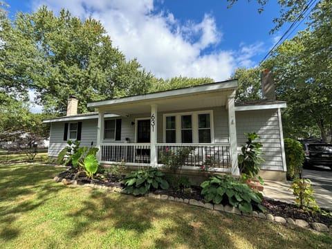 Front of home features covered porch with seating 