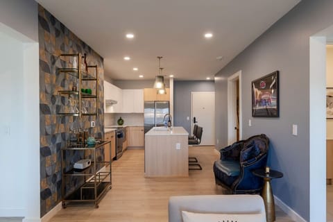 Stylish kitchen with sleek cabinetry, a central island, and a cozy seating area, creating a welcoming and functional living environment.