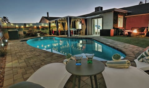 Large heated pool, hot tub, outdoor dining, & cozy sitting area w fire pit
