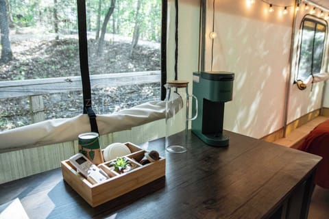 Equipped with a Keurig coffee maker, coffee pods, and cups.