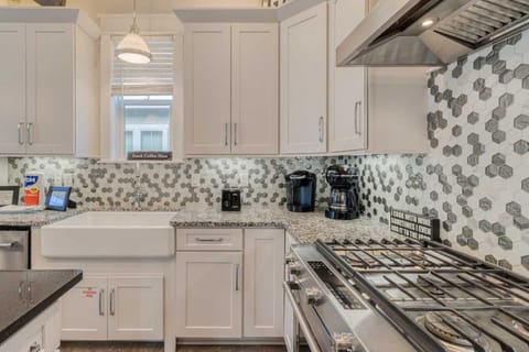 Kitchen: Keurig, drip coffee maker, blender, toaster, cookware, tableware, main floor
