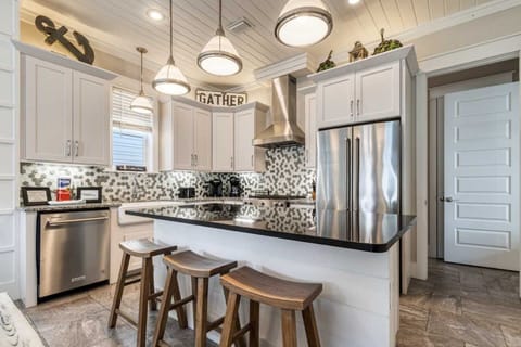 Kitchen: Keurig, drip coffee maker, blender, toaster, cookware, tableware, main floor
