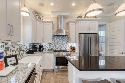 Kitchen: Keurig, drip coffee maker, blender, toaster, cookware, tableware, main floor
