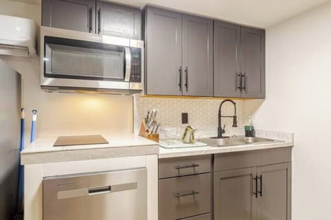 A kitchen beautiful kitchen containing dishwasher, a new blender etc.