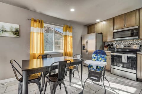 Enjoy home-cooked meals in the bright dining area, complete with seating for the whole family and a high chair for little ones.