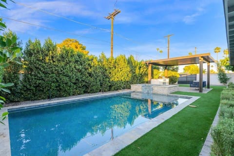 Refresh with a swim surrounded by privacy hedges and peaceful skies