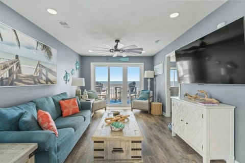 The ocean front living room is well-appointed with comfortable furnishings.