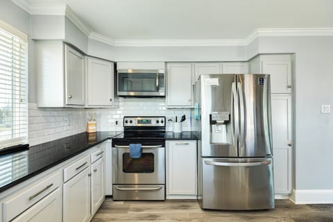 Fully equipped kitchen with stainless steel appliances