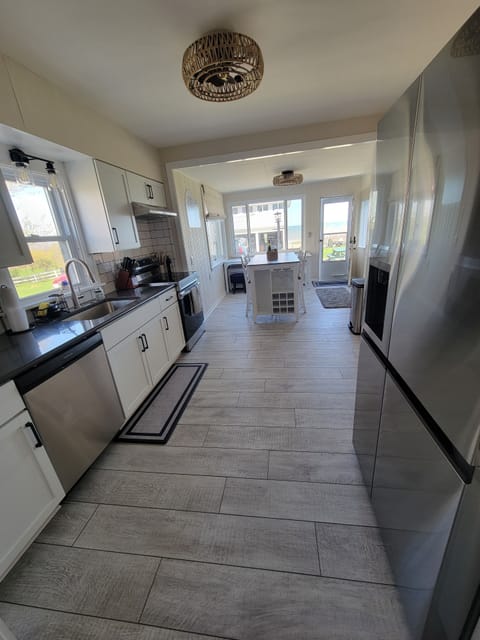 This Lake Erie view kitchen has new appliances and seating for 7.