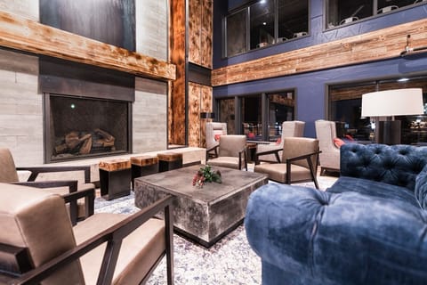 Elegant common area with high ceilings, rustic details, and a soothing ambiance, offering a perfect blend of comfort and sophistication.