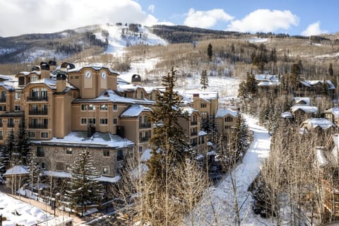 Picturesque mountain retreat with cozy lodges and breathtaking vistas, ideal for a serene winter escape.