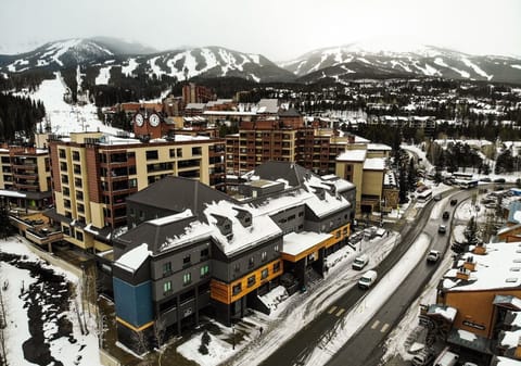 Picturesque alpine village surrounded by breathtaking snow-capped mountains, offering the perfect winter escape.