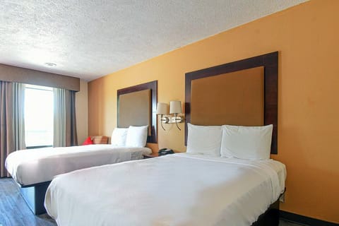 Relax in soft bedding with calming light from the window.