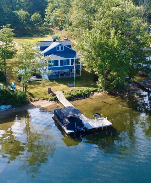 Large dock, multiple outdoor seating areas, fire pit, and lots of parking