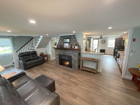 Open concept living room/kitchen with gas fireplace