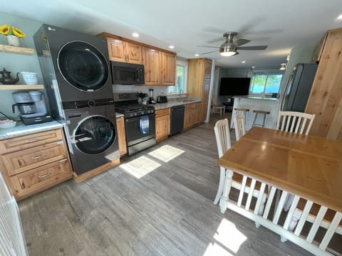 Kitchen has two bar stools for additional seating. Keurig coffee maker as well as drip coffee.