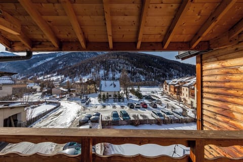 A stunning balcony view overlooking the snow-covered landscape, offering breathtaking mountain scenery.