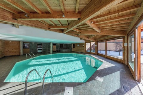 The indoor heated pool, bathed in natural light, offering a perfect spot to relax after a day on the pistes.