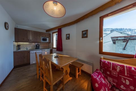 A spacious open-plan kitchen and dining area, blending comfort and functionality for an enjoyable stay.