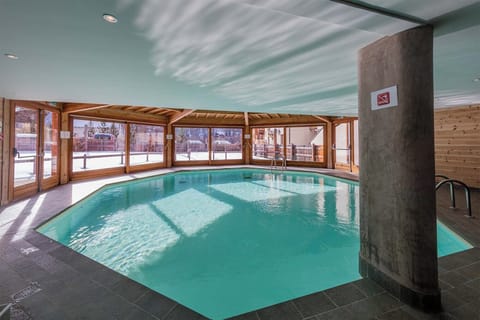 Enjoy a swim with a view! The large windows connect the indoor pool to the breathtaking mountain scenery.