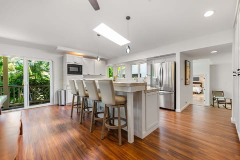 Spacious and bright, this open-concept layout connects the kitchen and dining areas seamlessly.