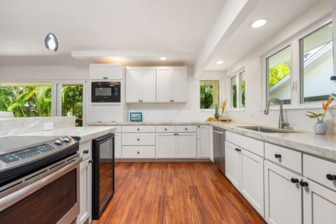 This kitchen is a chefs paradise with ample space to create your favorite meal.