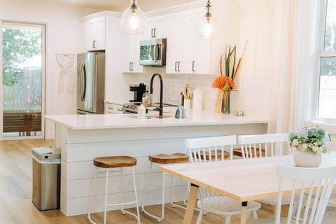 Gather at the dining table for six or the kitchen counter with 4 barstools