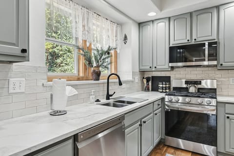 Kitchen with gas range/oven, microwave and dishwasher