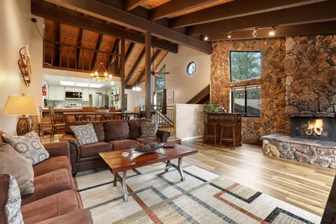 Cozy and spacious living area with TV and fireplace