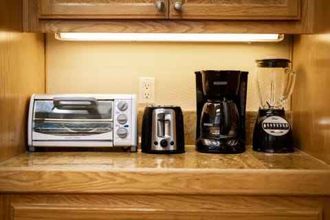 Kitchen with drip coffee maker, toaster oven, blender, waffle maker, slow cooker, and more!