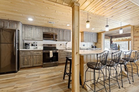 Spacious island with plenty of seating, seamlessly connecting the kitchen and living area