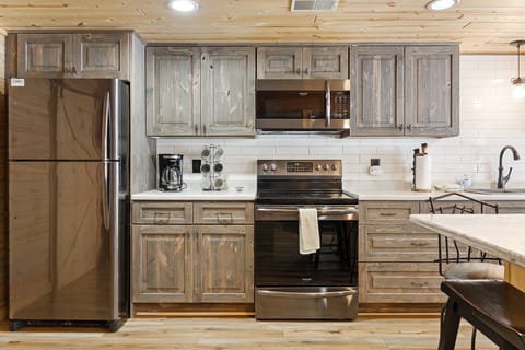 Fully equipped, updated kitchen designed for effortless cooking or enjoying your favorite takeout.