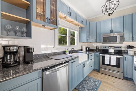 Prepare your meals in style with modern appliances and plenty of counter space in this charming kitchen.