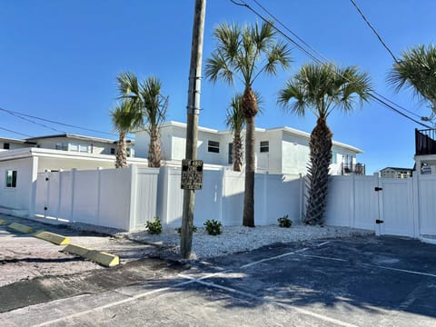 Behind this fence lies an oasis complete with a gorgeous new pool and landscaping