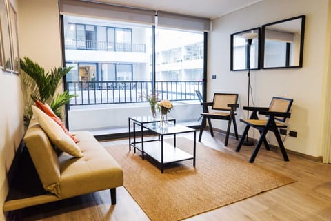 Bright and inviting living space with modern decor and ample natural light, perfect for relaxation.