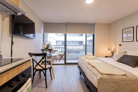 Cozy studio with a private balcony, perfect for a relaxing stay in the heart of the city. Enjoy modern amenities and a comfortable setting.