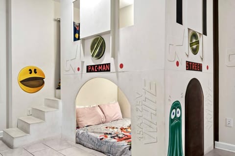 Level up bedtime in this retro Pac-Man themed bunk—perfect for little gamers!