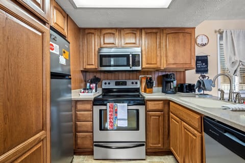 Kitchen with a coffee maker and toaster.