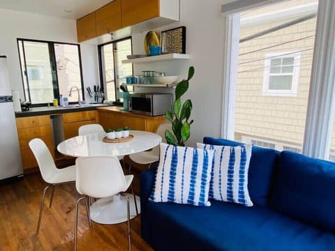 Sofa folds out into a sofa sleeper. Dining area seats four people.